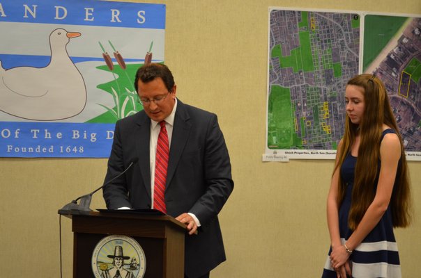 Southampton Town Councilman Chris Nuzzi and Shannon Merker, who designed the official flag for the hamlet of Flanders. BY KRISTEN DOULOS