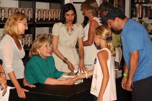 Hillary Rodham Clinton signs copies of her book “Hard Choices,” at Books & Books on Main Street in Westhampton Beach last summer.  PRESS FILE