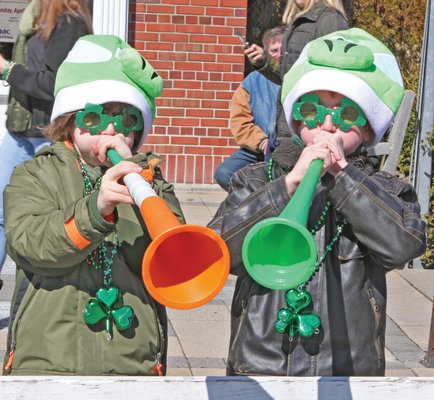 March 14: Michael Catalanotto and Bobby Strebel, right, get in tune just prior to the start of the 46th annual Westhampton Beach St. Patrick’s Day parade on Saturday.