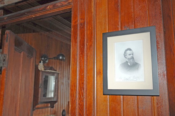 Little has change in the house since William Cauldwell, picture on wall, lived there in the 1800s.  DANA SHAW