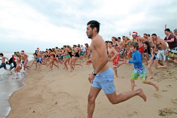 January 2: Swimmers make the mad dash to the water at the New Year’s Day Polar Bear Plunge at Atlantic Avenue Beach in Amagansett.