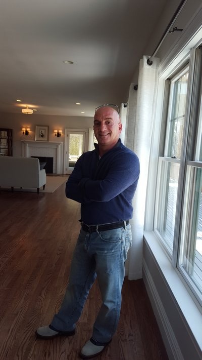 Lawrence Citarelli welcomes guests at his open house in Westhampton. BRIDGET LEROY