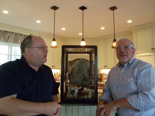 Roger Blaugh and Michael Forestano with the nest in its display case. BRIDGET LEROY