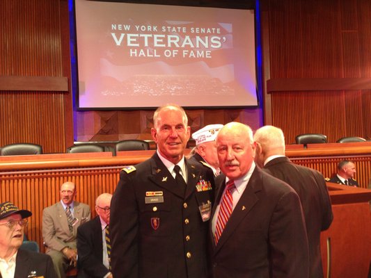 Former U.S. Army pilot George Drago, left, was selected by New York Senator Kenneth P. LaValle for induction into the New York State Veterans’ Hall of Fame. The induction ceremony took place in Albany on Tuesday. BY SUBMITTED