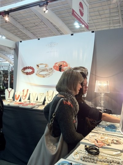 Inspecting gift jewelry at the Gift Show. SUSAN KELLY