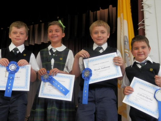 The Our Lady of the Hamptons math team of, left to right, Bryan Ambrose, Bridget Ferguson, Fred Chrysler and Calvin Henke took first place in the primary math team challenge. By submitted