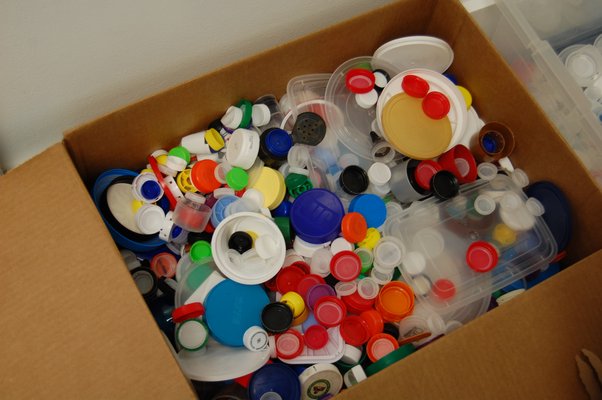 The collection box of plastic caps outside Nina Landi's kindergarten classroom at the Sag Harbor Elementary School as part of the Caps To Benches project. JON WINKLER