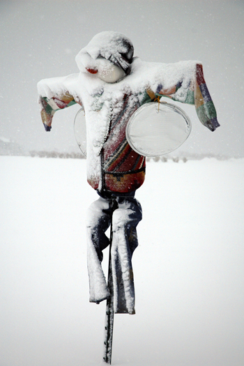 A snow-covered scarecrow.<br>Photo by Joe Loucheim