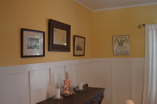 In the dining room on the left sits the potter's "self-portrait." On the back wall is an original painting dated 1964, just a few years before the artist Raymond Hedler's death. It was purchased for less than $30. CHRIS ARNOLD