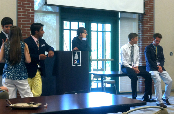 Junior Statesmen Foundation members hold debates at the convention on Tuesday.