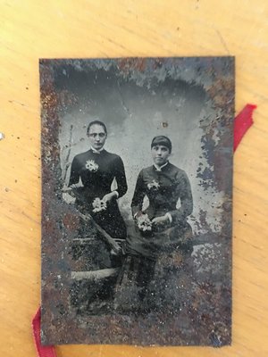 Somber women with flowers in a tintype discovered during the project. COURTESY JEFF CULLY