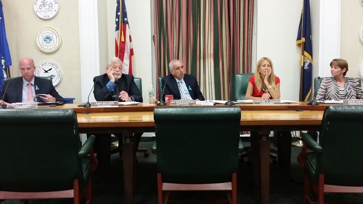 Southampton Town Board listens to Laura Smith, president of the Civil Service Employees Association, regarding the settlement between the union and town.   JEN NEWMAN