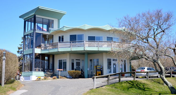 The-crescent patterned roof of the octagonal Wavecrest Resort office is intended to resemble waves, thus the name. While the resort is generally in good shape, the weedy entry and Snapple machine are a tad lamentable. CHRIS ARNOLD