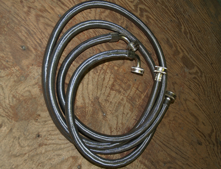 Stainless steel meshed washing machine hoses.  JENNETT MERIDEN RUSSELL