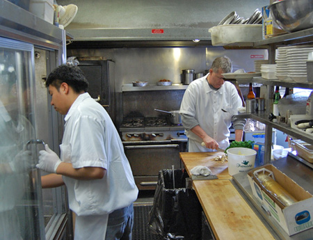 Mitch Kruszyna and Hector Franco at work in the kitchen. BRIAN BOSSETTA