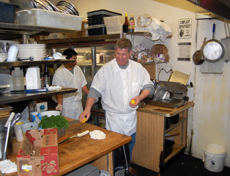 Mitch Kruszyna and Hector Franco at work in the kitchen. BRIAN BOSSETTA