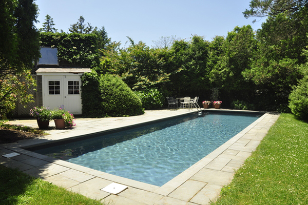 Poolside at Joan and Mort Hamburg's garden in Sagaponack, which will be featured on the "Landscape Pleasures: Down the Garden Path" tour this weekend. MICHELLE TRAURING