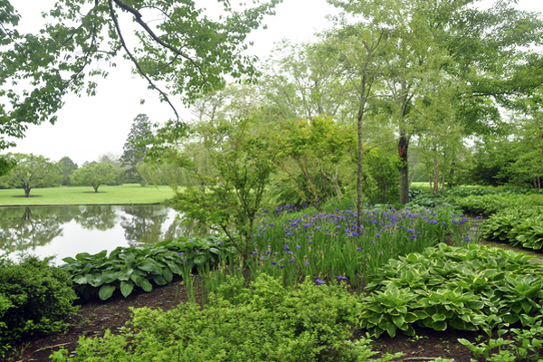 The wooded pond of “Four Fountains,” an estate garden in Southampton that will be featured on the Animal Rescue Fund of the Hamptons' annual tour "A Peek Behind the Hedges" this weekend. MICHELLE TRAURING