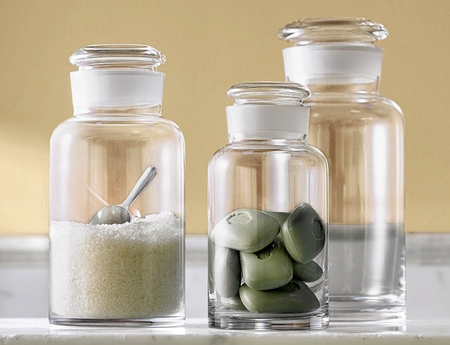 Glass apothecary jars make for convenient at-a-glance bathroom storage