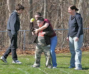 Noah Dedona winding up for the softball toss.