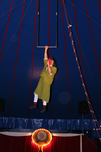Nino the Clown, hangs from the trapeze, at the Zoppe Italian Circus last year.