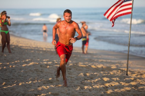 A lifeguard in the run-swim-run.