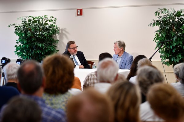 Joe Shaw, the executive editor of the Express News Group and Bill Keller, the former executive editor of The New York Times at the Rogers Memorial Library on Thursday.      DANA SHAW