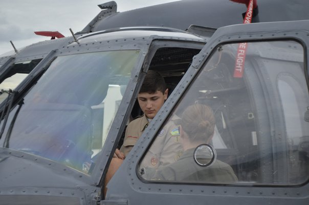 Life Scout Conner Blunnie sitting in the HH-60G Pave Hawk helicopter cockpit. ANISAH ABDULLAH