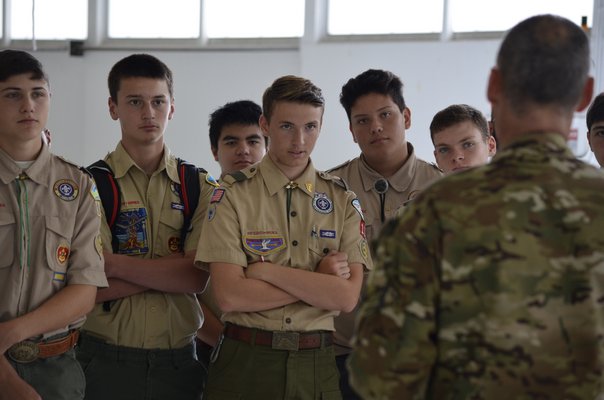 The Boy Scouts group listening to Lieutenant Colonel Stephen 