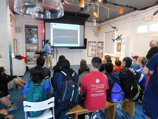 Kevin Reed, a Stony Brook University professor, delivered a lecture about extreme weather on Thursday at the Montauk Lighthouse.   ELIZABETH VESPE
