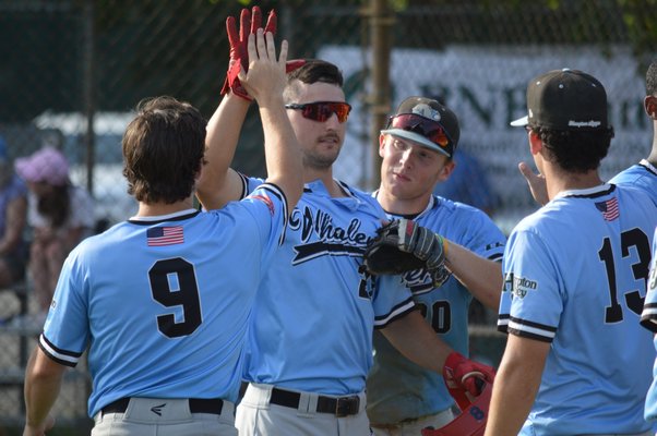 Teammates congratulate Andrew Bates (South Alabama) after his fifth-inning home run against Riverhead on Friday.
