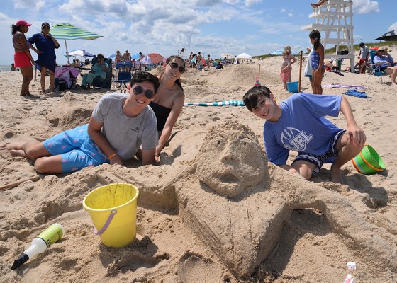 Conditions were perfect for the annual Clamshell Foundation sandcastle contest at Atlantic Beach in Amagasett on Saturday. Carson, Marnie, and Cooper Kelley with their surfing creature. KYRIL BROMLEY PHOTOS