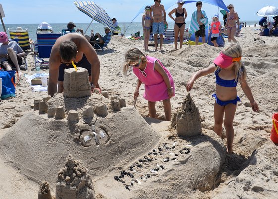 Conditions were perfect for the annual Clamshell Foundation sandcastle contest at Atlantic Beach in Amagasett on Saturday. Brian, Piper, and Penny Pitz with their “Monarch Mansion.
