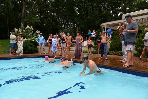 The third annual Swim For The Cure was held at the home of Billy, Dominique and Tommy Kahn in East Hampton on Saturday.