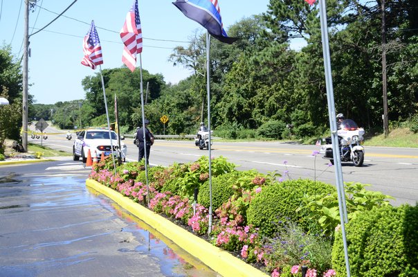 President Donald Trump's motorcade was escorted by several police officers on motorcycles from the Suffolk County Police Department. GREG WEHNER