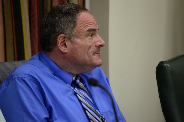 Southampton Town Zoning Board of Appeals Chairman Adam Grossman listened to residents who were concerned about a proposal to construct 120 condominiums in North Sea. GREG WEHNER