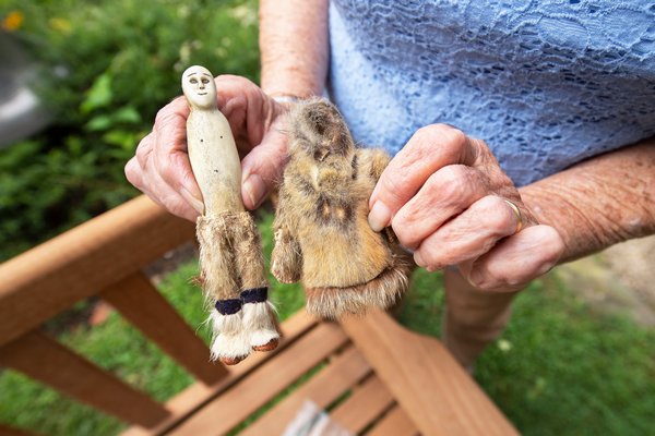 Barbara Schwartz holds an Alaskan handmade doll from (she believes) the 1950s that she brought to be appraised by Black Swan Antiques proprietor Randy Kohloff during the Family Heirloom Appraisal event hosted at the Annie Cooper Boyd House by the Sag Harbor Historical Society on Friday.     MICHAEL HELLER