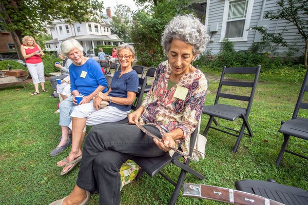 Kathy Loscalzo examins a Sikh sword with Hindu writing that she brought to be appraised by Black Swan Antiques proprietor Randy Kohloff during the Family Heirloom Appraisal event hosted at the Annie Cooper Boyd House by the Sag Harbor Historical Society on Friday.   MICHAEL HELLER