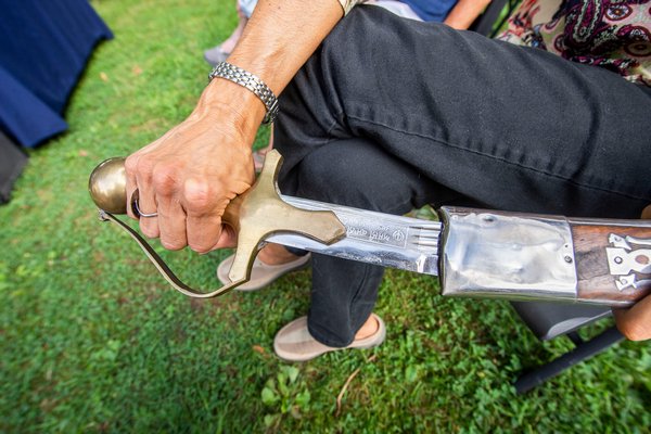 Kathy Loscalzo shows off a Sikh sword with Hindu writing that she brought to be appraised by Black Swan Antiques proprietor Randy Kohloff during the Family Heirloom Appraisal event hosted at the Annie Cooper Boyd House by the Sag Harbor Historical Society on Friday.    MICHAEL HELLER