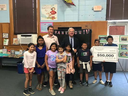 Assemblyman Fred W. Thiele Jr. presented Springs School with a $50,000 check on Monday.   ELIZABETH VESPE