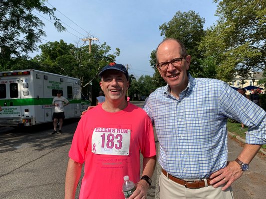 Democratic congressional hopeful Perry Gershon, left, with Stony Brook Southampton Hospital Chief Administrative Officer Robert Chaloner near the finish line on Sunday.