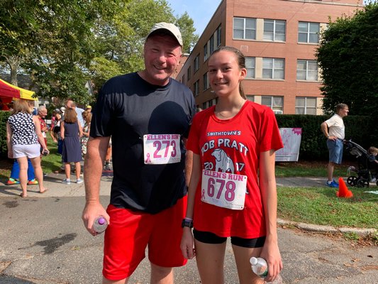 Pierson cross country coach Jim Kinnier with his star runner, Penelope Greene, on Sunday.