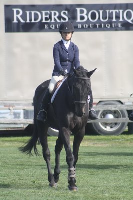 Lauren Reischer and her horse, Reade, in the adult equitation division. Reischer, who has cerebral palsy, has been champion in the LISSRD division in the past at the Hampton Classic and rode on Locals Day for the first time this year.