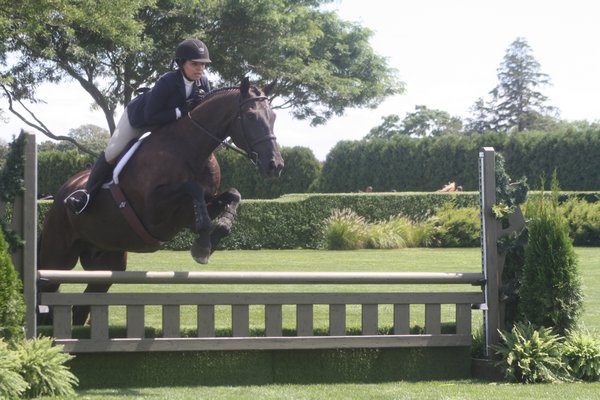 Leanne Daley and her horse, Daughtry, compete in the local junior hunter division.