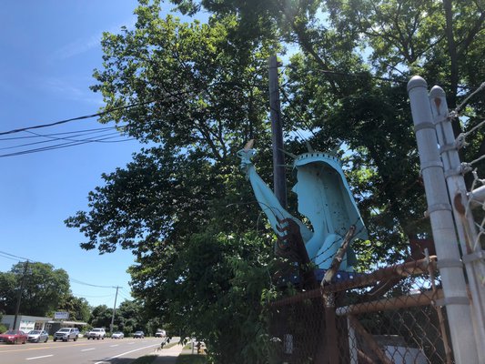 The metal Statue of Liberty resides in the Liberty Iron Works parking lot on the side of County Road 39A.