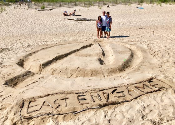More scenes from the annual sandcaste contest, sponsored by the Clamshell Foundation, at Atlantic Beach in Amagansett. Adam and Eliza Liebowitz picture with their father, Rob Liebowitz. DONNA LIEBOWITZ