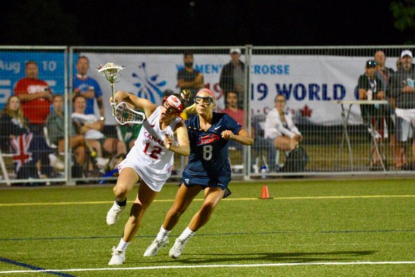 Isabelle Smith defends against a Canadian player.