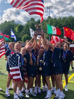Isabelle Smith and her U.S. teammates celebrate their U19 World Championship after defeating Canada, 13-3, on Saturday.