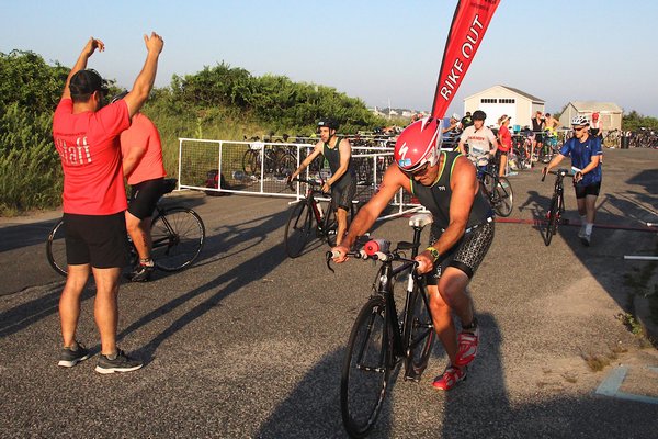 Swimmers turn into bikers at one of the two transition areas on the course.