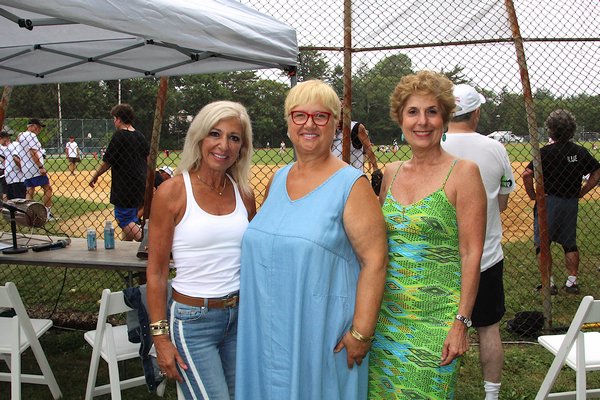 Justice Patricia M. DiMango, left, who threw out the first pitch, with celebrity chef Lidia Bastianich and Juliet Papa of 1010Wins, who did the announcing on Saturday.